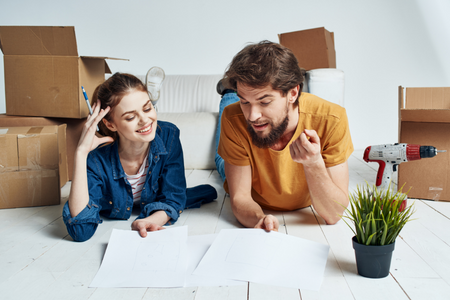 Man Selecting New House On Laptop At Home